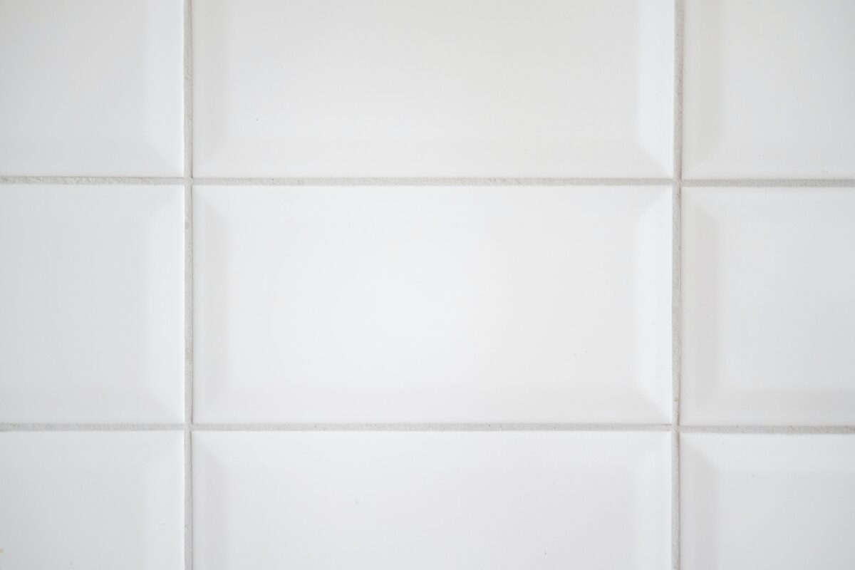 white tile background in kitchen.